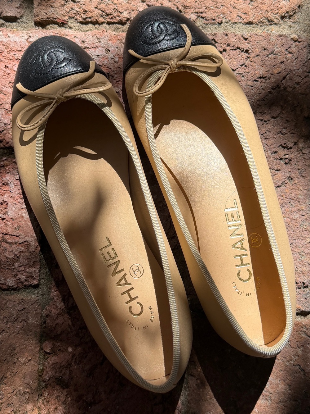 CHANEL Two-Tone Beige and Black Leather Cap-Toe Ballet Flats